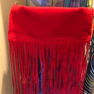 Chic red handbag.wear as a clutch, crossbody or shoulder.  fringe for pop of fun